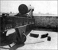 A cannon at the heavily-fortified Morro Castle, built in 1710, overlooks Havana Harbor. In the distance is the skyline of Havana.